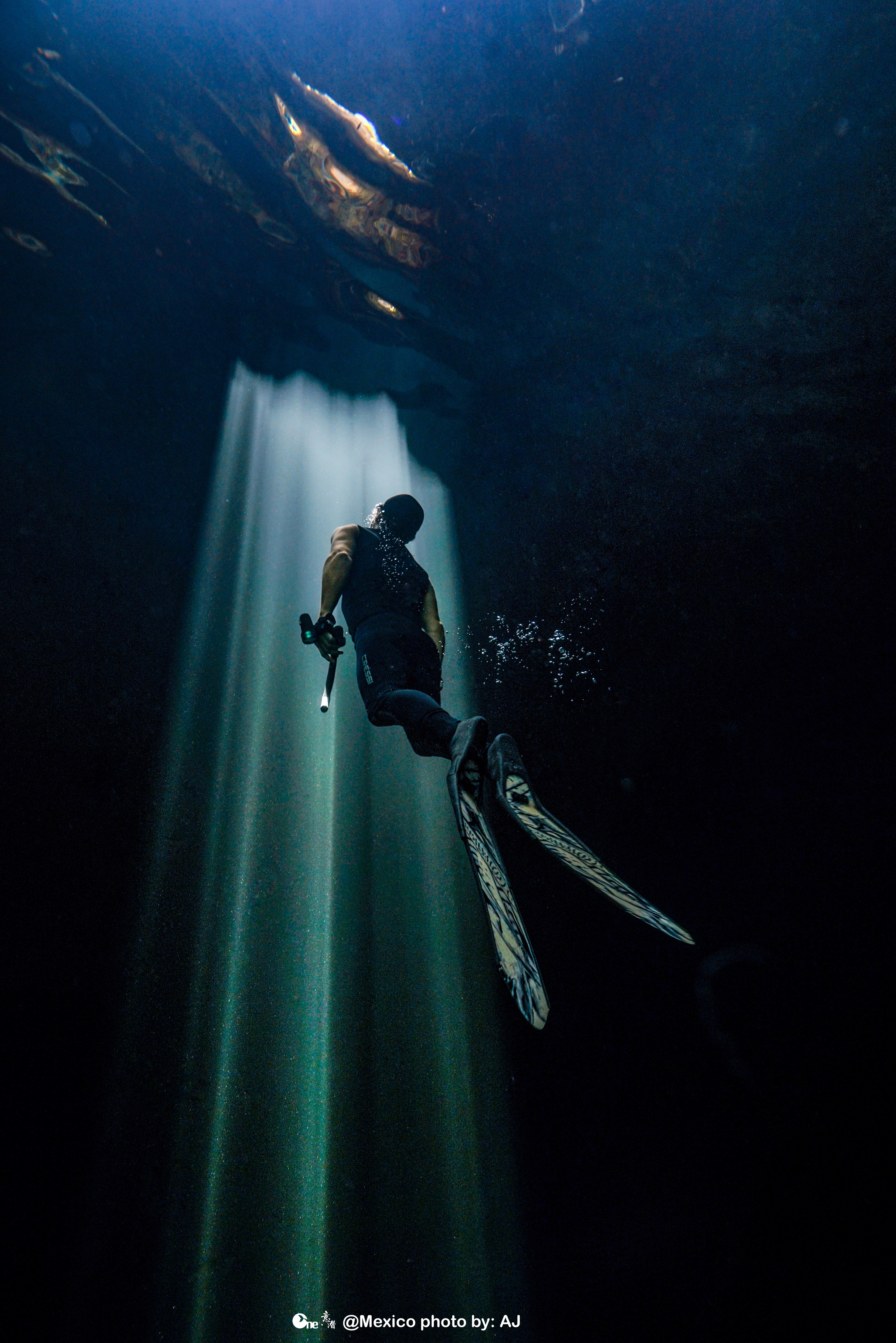 Freedive Tulum instructor cElvis James ascending into the light